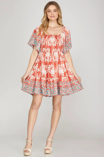 RED SMOCKED BORDER PRINT WOVEN MINI DRESS
